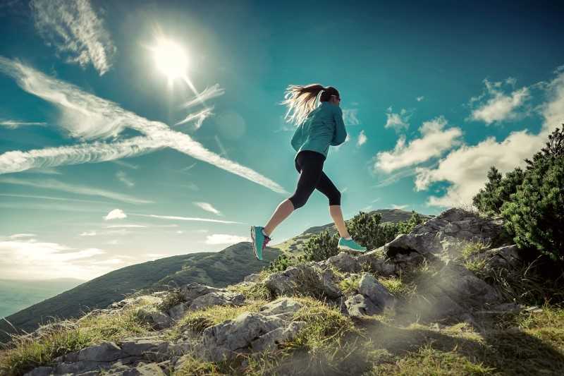 woman running in the hills